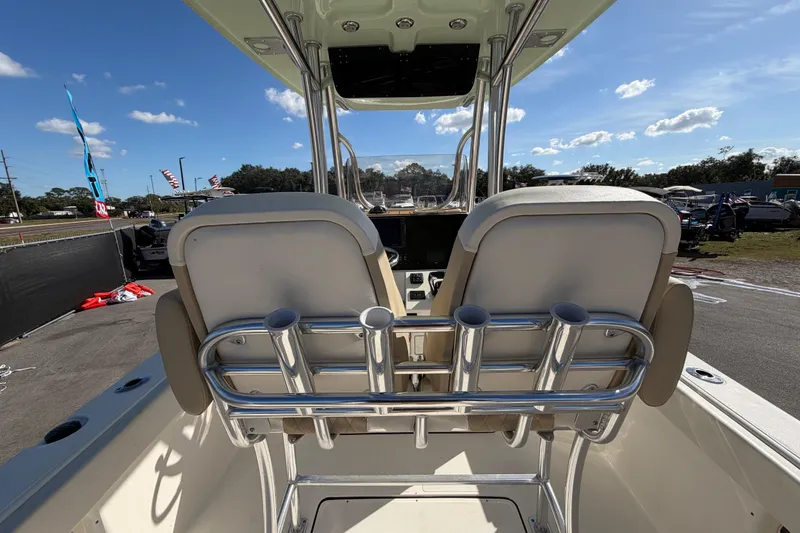 Slide: The Image of 2025 Bulls Bay 255 Center Console boat interior with rod holders and seating. - 23