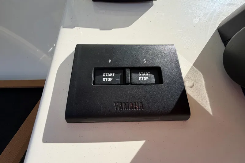 Slide: The Image of Bennett trim tab control on 2025 Bulls Bay 255 Center Console boat. - 35