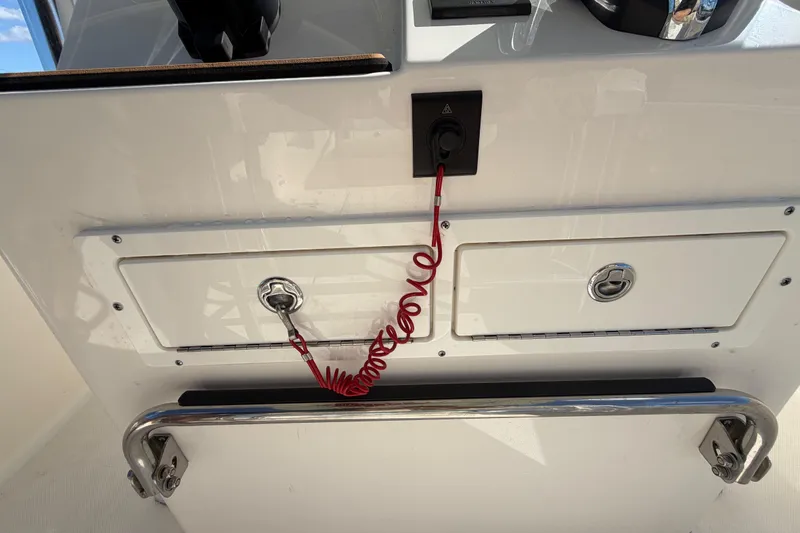 Slide: The Image of 2025 Bulls Bay 255 Center Console boat controls with Yamaha throttle and start-stop buttons. - 37