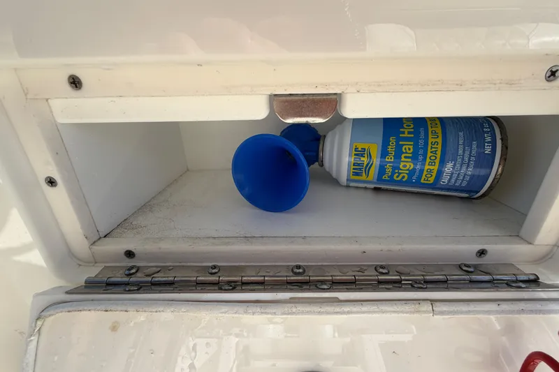 Slide: The Image of Bulls Bay 255 Center Console 2025 boat ignition with red safety lanyard. - 39