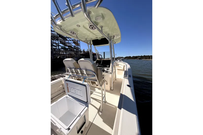 Slide: The Image of 2025 Bulls Bay 255 Center Console with twin Yamaha 200 engines, outdoor display. - 4