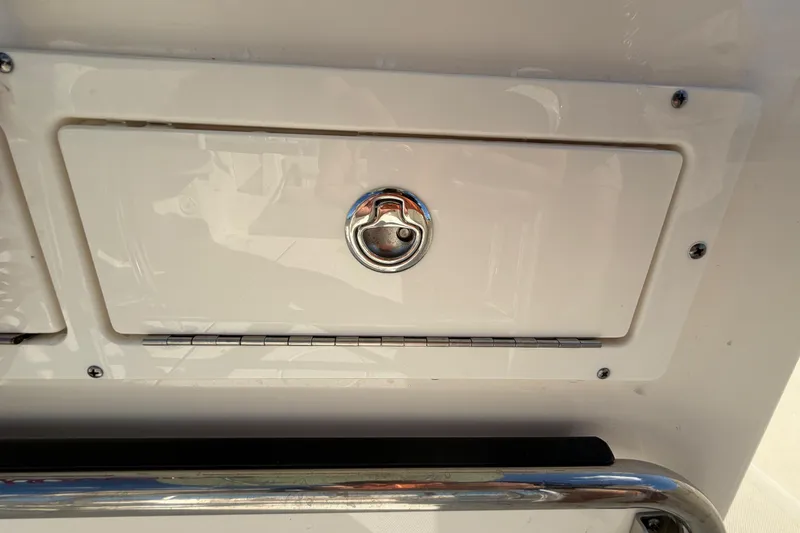 Slide: The Image of Storage compartment with a signal horn on a 2025 Bulls Bay 255 Center Console boat. - 40