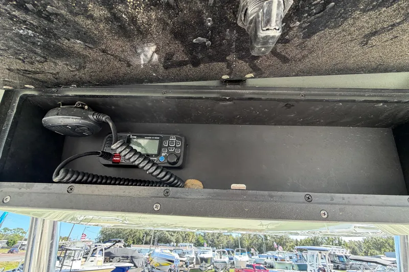 Slide: The Image of 2025 Bulls Bay 255 Center Console boat with overhead storage compartment, outdoor setting. - 43