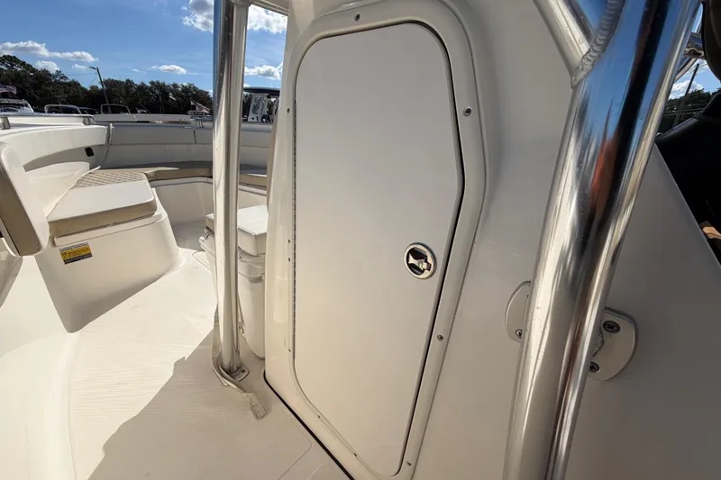 Slide: The Image of 2025 Bulls Bay 255 Center Console boat storage with radio equipment. - 44
