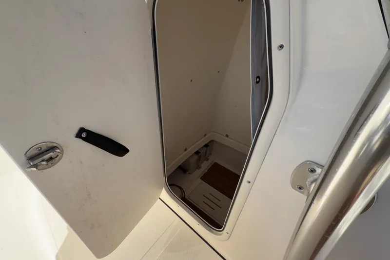 Slide: The Image of 2025 Bulls Bay 255 Center Console boat interior with seating and storage. - 45