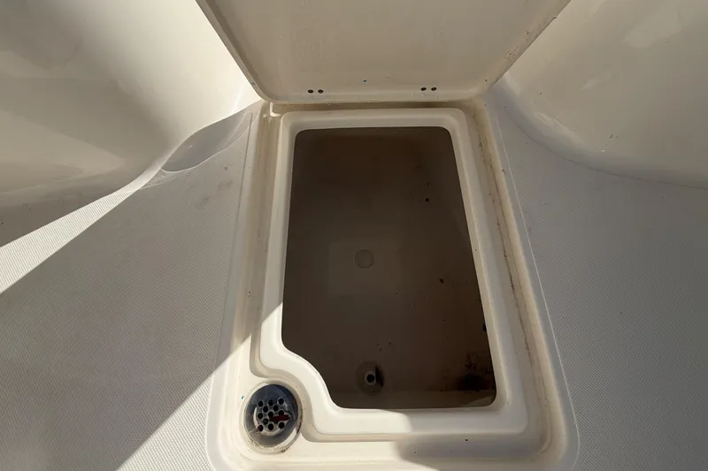 Slide: The Image of 2025 Bulls Bay 255 Center Console boat deck with storage hatch. - 50