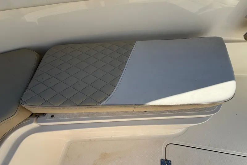 Slide: The Image of Storage compartment with coiled rope on a 2025 Bulls Bay 255 Center Console boat. - 55