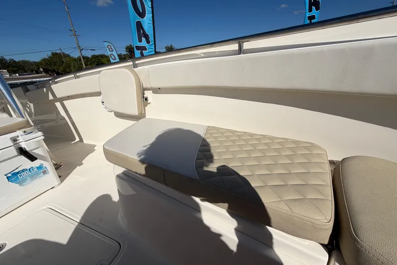 Slide: The Image of 2025 Bulls Bay 255 Center Console boat interior with cushioned seating. - 66