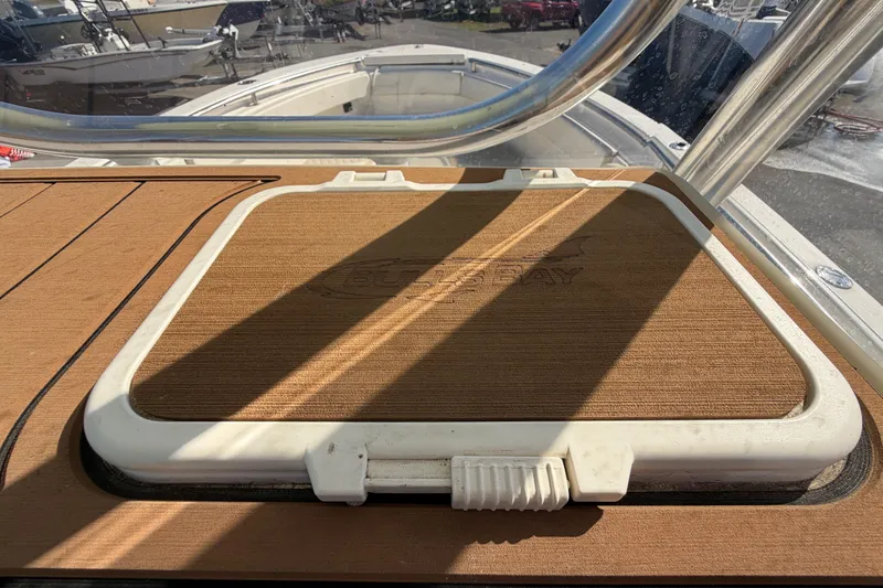 Slide: The Image of 2025 Bulls Bay 255 Center Console boat with dual seats and T-top on display. - 73