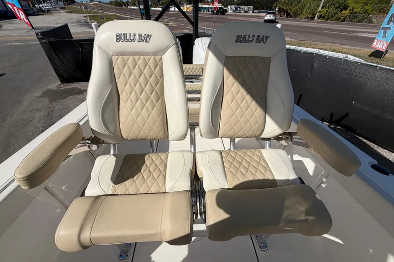 Slide: The Image of 2025 Bulls Bay 255 Center Console boat seats with diamond-pattern upholstery. - 76