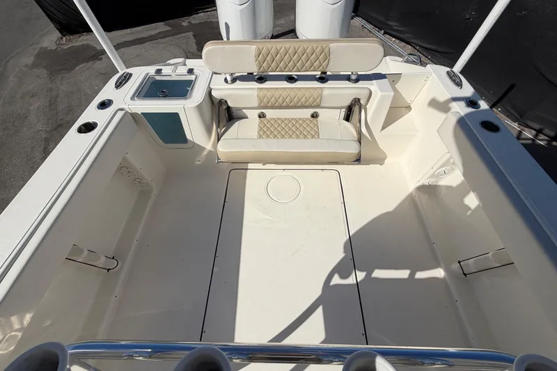 Slide: The Image of 2025 Bulls Bay 255 Center Console boat interior with seating and storage. - 77