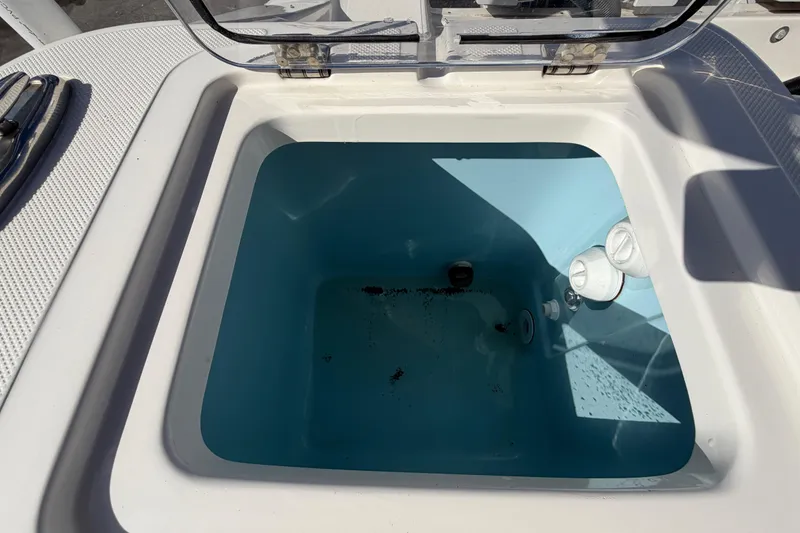 Slide: The Image of Open storage compartment on 2025 Bulls Bay 255 Center Console boat. - 79