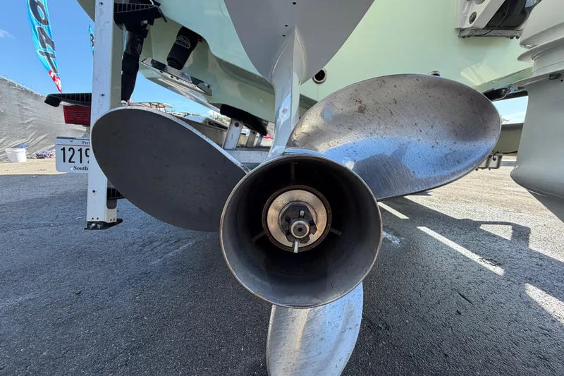 Slide: The Image of Close-up of a 2025 Bulls Bay 255 Center Console boat propeller on pavement. - 8