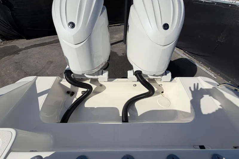 Slide: The Image of 2025 Bulls Bay 255 Center Console boat with dual outboard engines. - 81