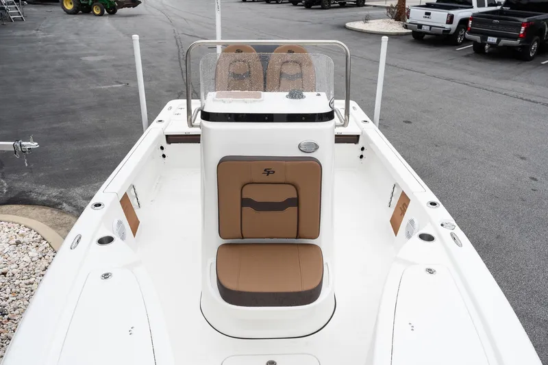 Slide: The Image of 2026 Sea Pro 210 Bay boat seats with Suzuki engine in parking lot. - 14