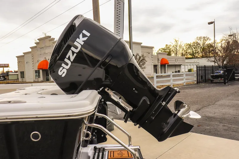 Slide: The Image of 2026 Sea Pro 210 Bay boat with Suzuki outboard motor in urban setting. - 20