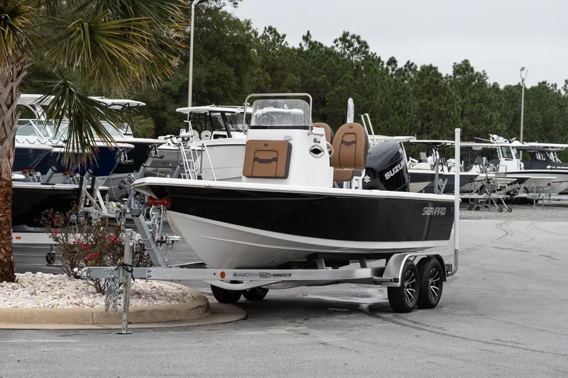Slide: The Image of 2026 Sea Pro 210 Bay boat on trailer, rear view with outboard motor. - 3