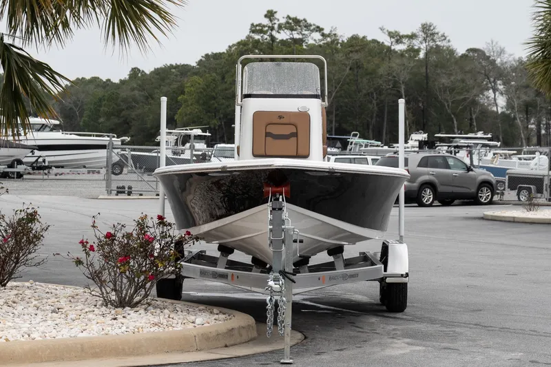 Slide: The Image of 2026 Sea Pro 210 Bay boat with Suzuki outboard motor on a trailer. - 4