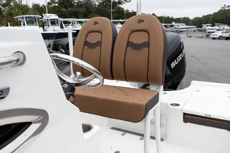 Slide: The Image of Sea Pro 210 Bay 2026 boat emblem with chrome handle detail. - 9