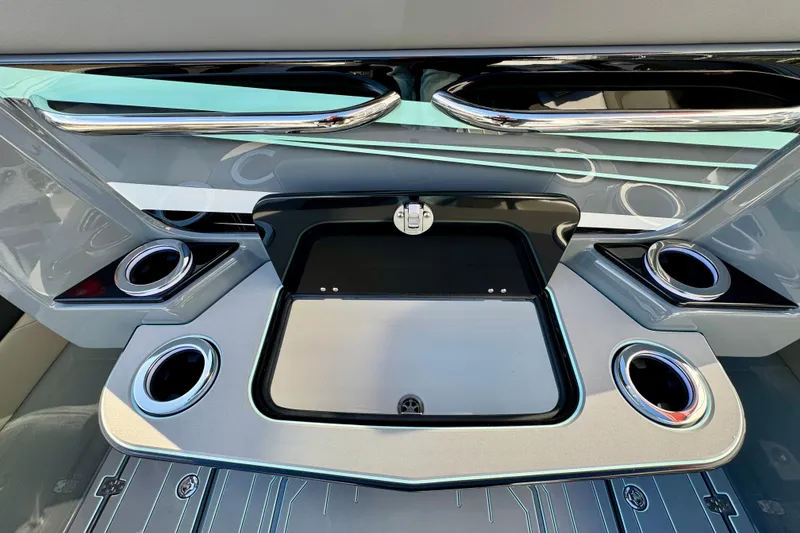 Slide: The Image of 2026 Sunsation 32 CCX boat interior with sleek design and multiple cup holders. - 11