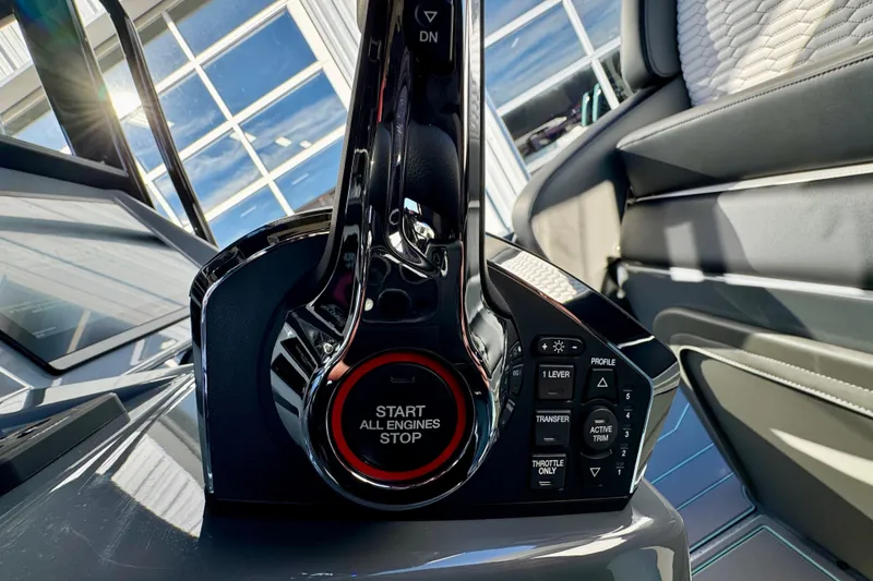 Slide: The Image of 2026 Sunsation 32 CCX boat throttle control with start/stop button in cockpit. - 14