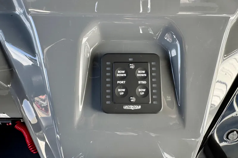 Slide: The Image of Control panel of 2026 Sunsation 32 CCX boat with Lectrotab trim tab switches. - 15