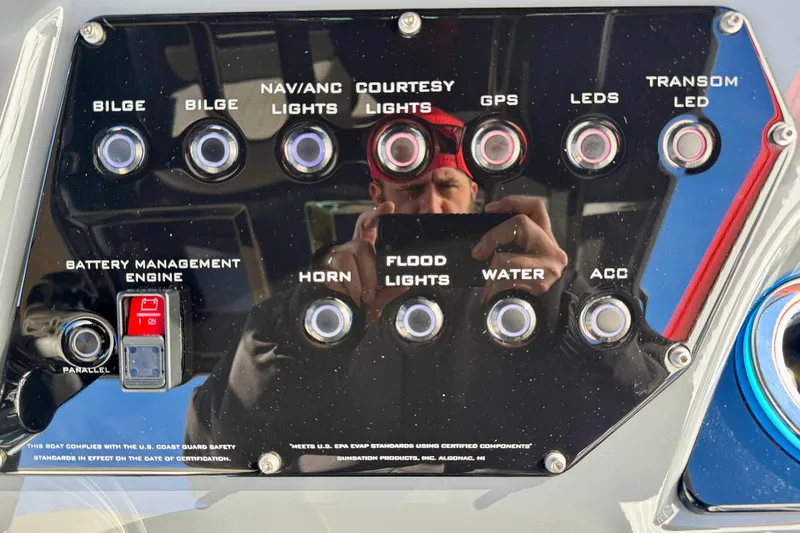 Slide: The Image of Control panel of 2026 Sunsation 32 CCX boat with various switches and labels. - 16