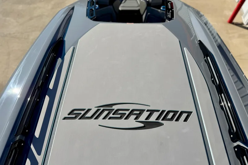 Slide: The Image of 2026 Sunsation 32 CCX boat deck with logo, showcasing sleek design. - 23