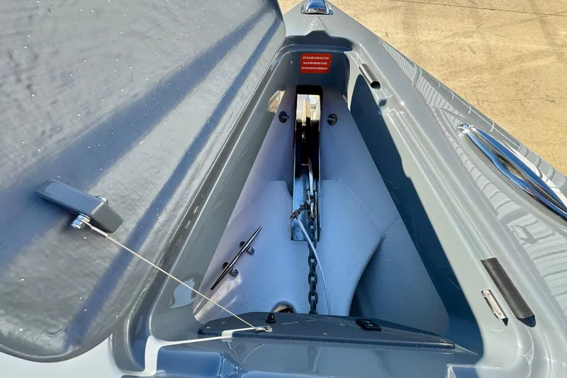 Slide: The Image of Anchor compartment of 2026 Sunsation 32 CCX boat, showcasing chain and mechanism. - 27
