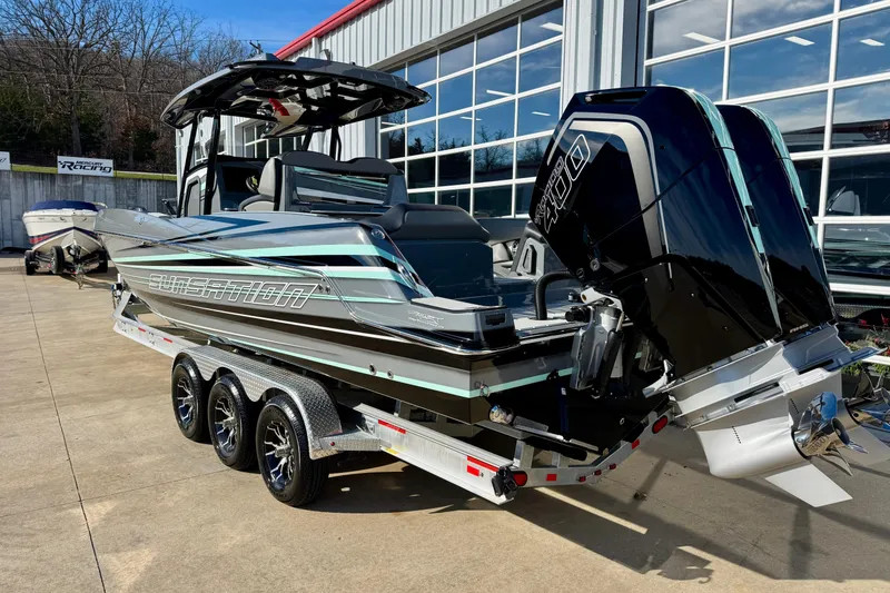 Slide: The Image of 2026 Sunsation 32 CCX boat with dual outboard engines on a trailer. - 7