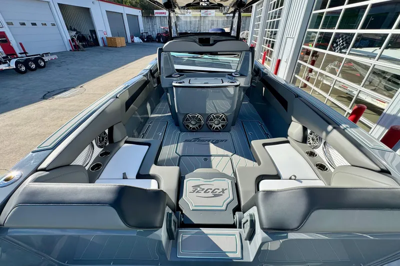 Slide: The Image of 2026 Sunsation 32 CCX boat interior with modern seating and audio system. - 9
