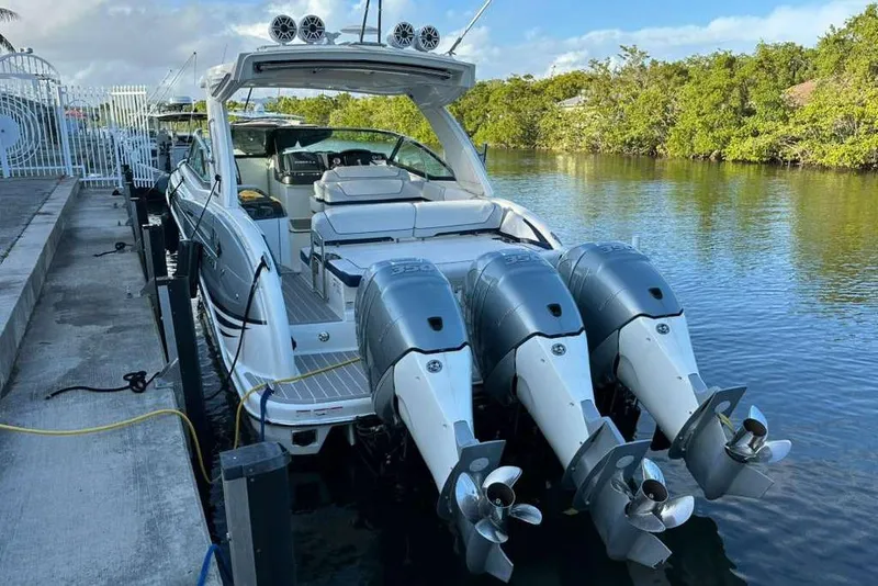 Slide: The Image of 2022 Formula 350 Crossover Bowrider OB docked with triple outboard engines. - 10