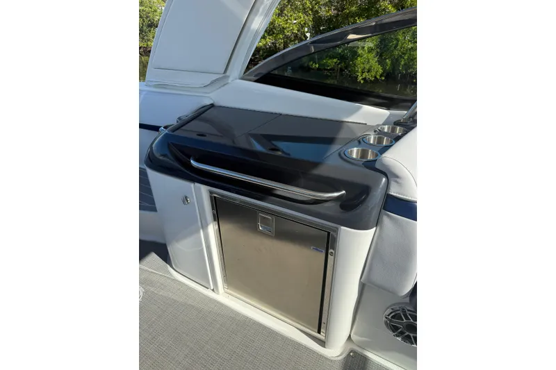 Slide: The Image of 2022 Formula 350 Crossover Bowrider OB interior with sleek kitchenette and cup holders. - 14