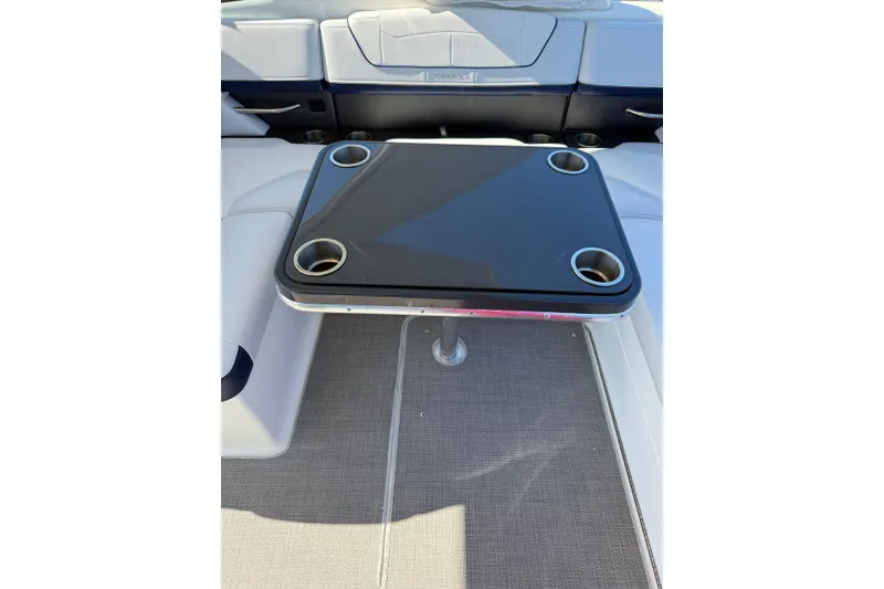 Slide: The Image of 2022 Formula 350 Crossover Bowrider OB interior with table and cup holders. - 23