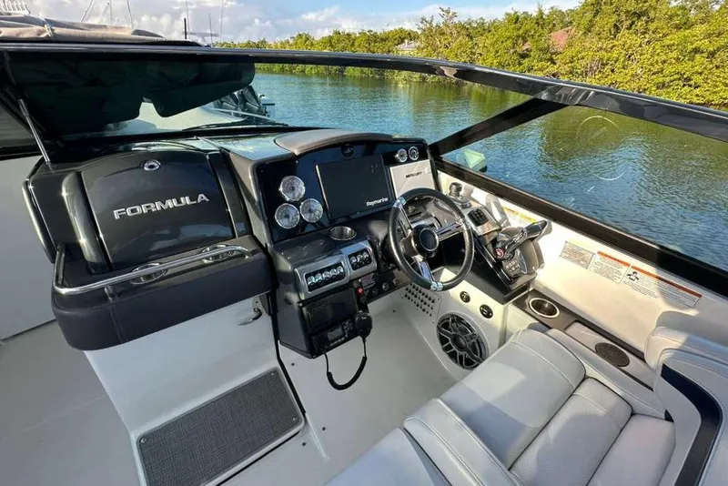 Slide: The Image of 2022 Formula 350 Crossover Bowrider OB cockpit with modern controls and luxurious seating. - 26