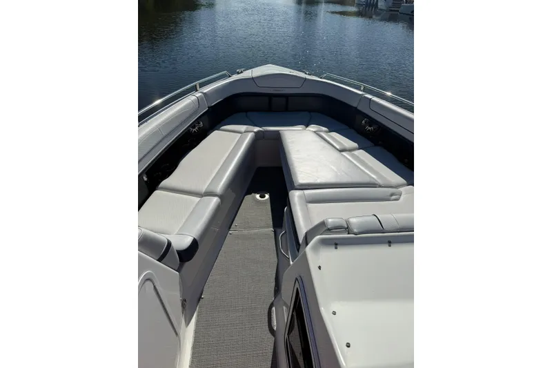 Slide: The Image of 2022 Formula 350 Crossover Bowrider OB interior with spacious seating on calm water. - 9