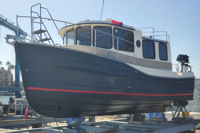 The Image of 2008 Ranger Tugs R-25 boat on dry dock at a shipyard. - 0