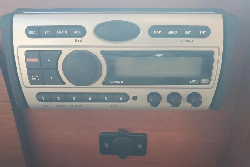 Slide: The Image of 2008 Ranger Tugs R-25 stereo system with iPod connectivity and control knobs. - 11