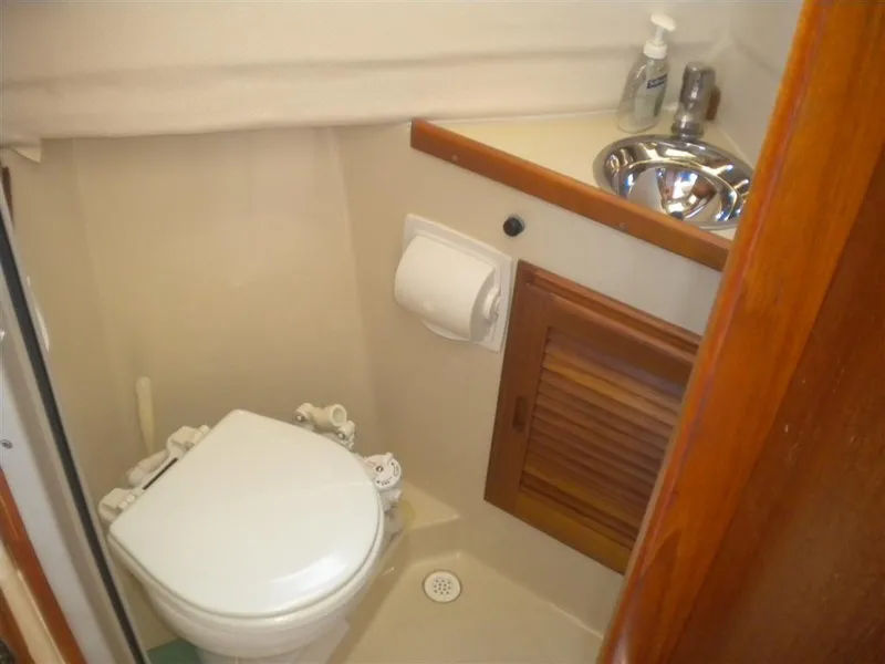 Slide: The Image of Compact bathroom in a 2008 Ranger Tugs R-25 boat. - 19