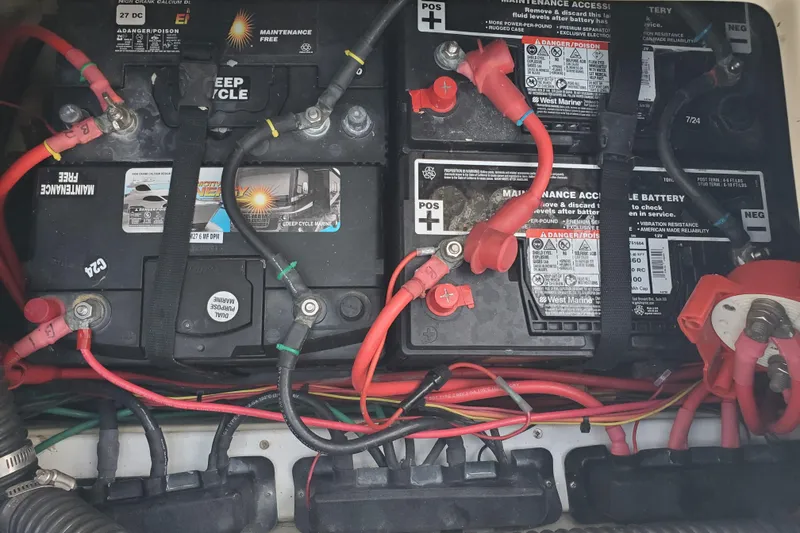 Slide: The Image of Battery compartment of a 2008 Ranger Tugs R-25 with multiple connected batteries. - 29