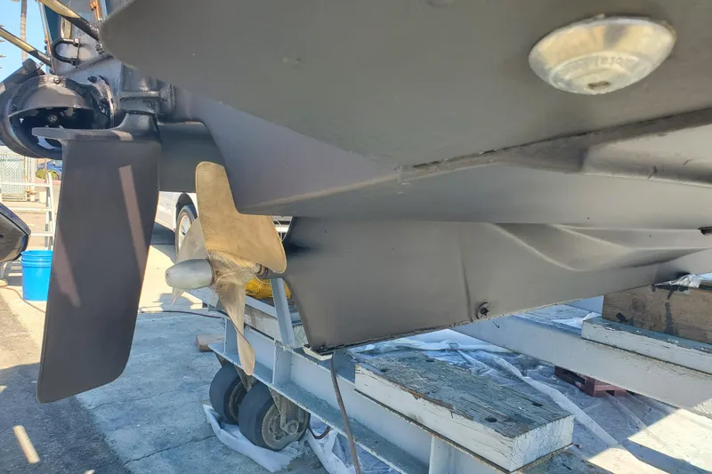 Slide: The Image of 2008 Ranger Tugs R-25 boat propeller and rudder detail in dry dock. - 32