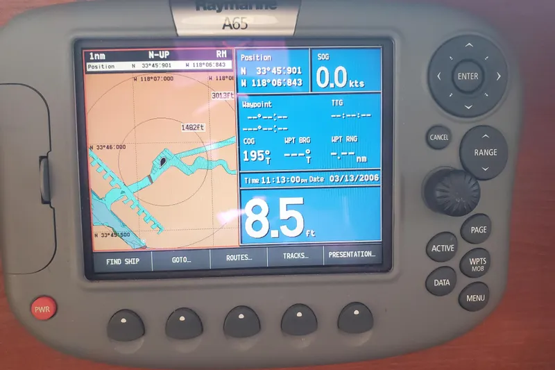 Slide: The Image of Raymarine A65 GPS display on 2008 Ranger Tugs R-25 boat, showing navigation data. - 4
