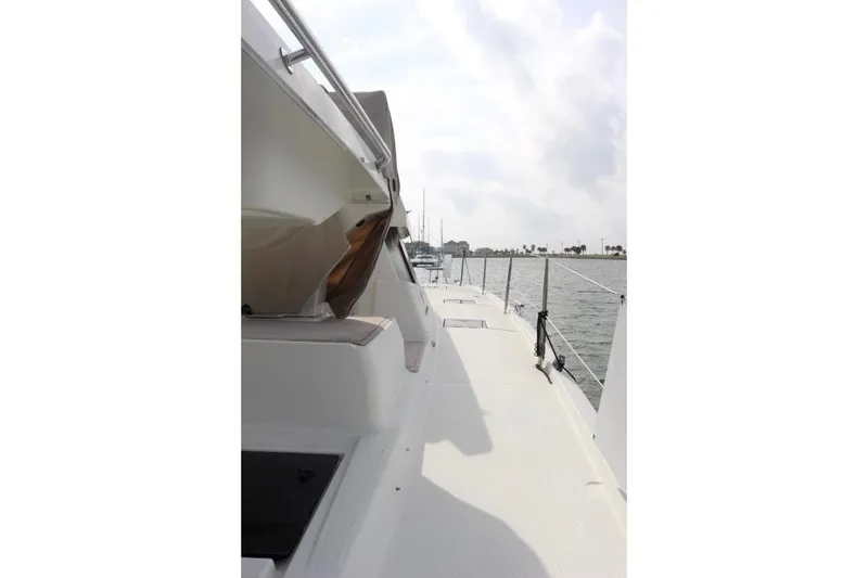 Slide: The Image of 2020 Fountaine Pajot Astrea 42 Catamaran deck view, sailing on calm waters. - 14