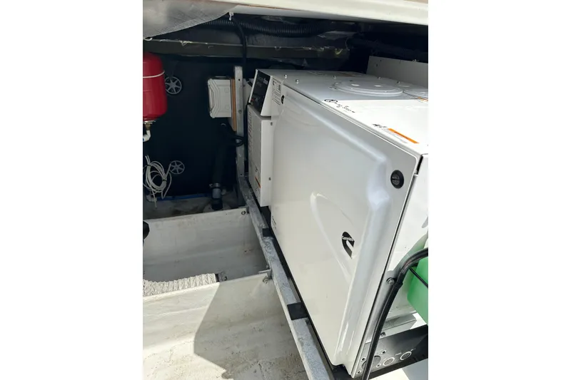Slide: The Image of Engine compartment of 2020 Fountaine Pajot Astrea 42 Catamaran, featuring mechanical equipment. - 19