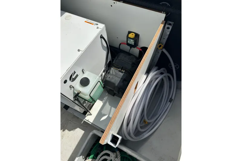 Slide: The Image of Engine compartment of a 2020 Fountaine Pajot Astrea 42 Catamaran with coiled hose. - 20