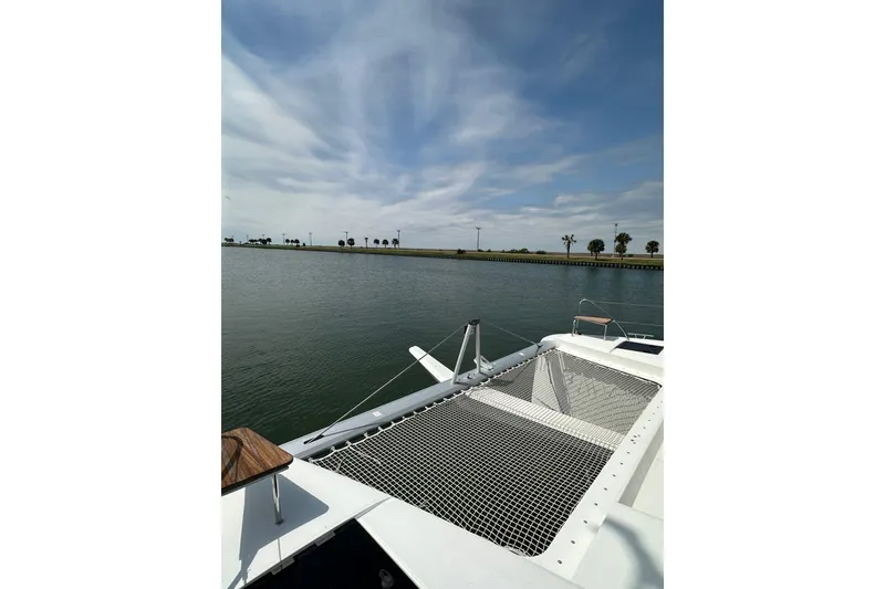 Slide: The Image of 2020 Fountaine Pajot Astrea 42 Catamaran on calm water under a partly cloudy sky. - 24
