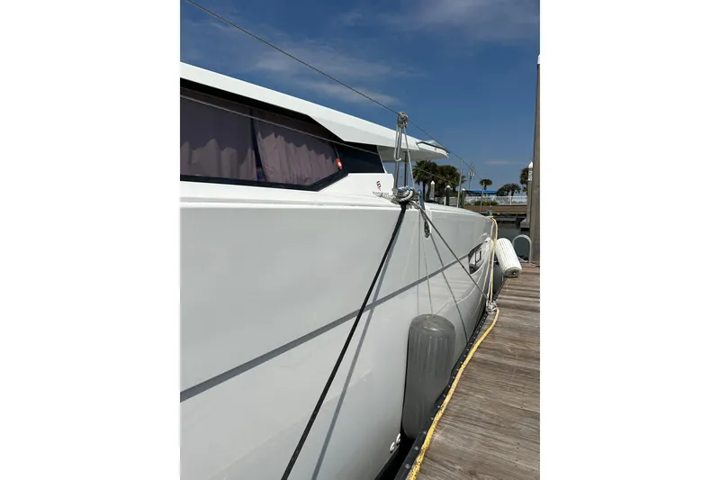 Slide: The Image of 2020 Fountaine Pajot Astrea 42 Catamaran docked, side view with clear sky. - 30