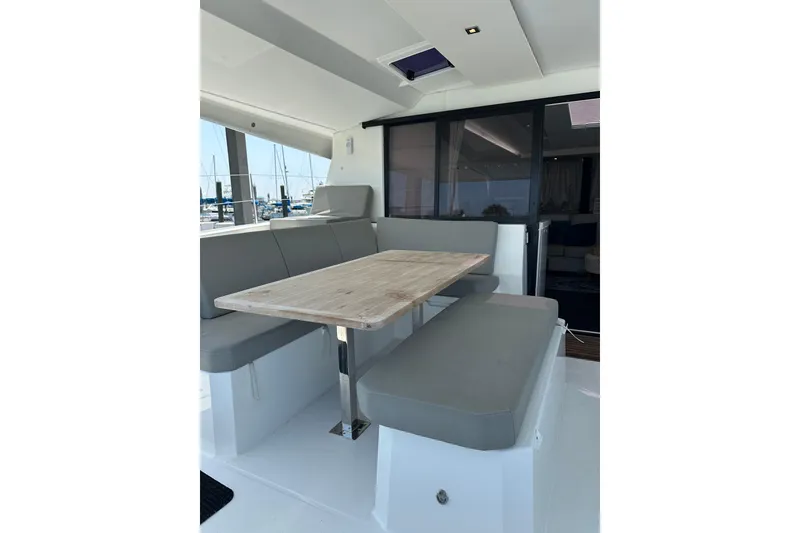Slide: The Image of 2020 Fountaine Pajot Astrea 42 Catamaran interior with dining area and seating. - 32