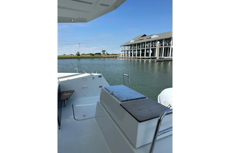 Slide: The Image of 2020 Fountaine Pajot Astrea 42 Catamaran docked near waterfront building. - 34