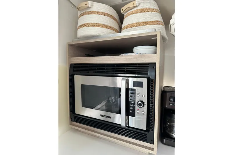 Slide: The Image of Microwave and baskets in Fountaine Pajot Astrea 42 Catamaran kitchen, 2020 model. - 39
